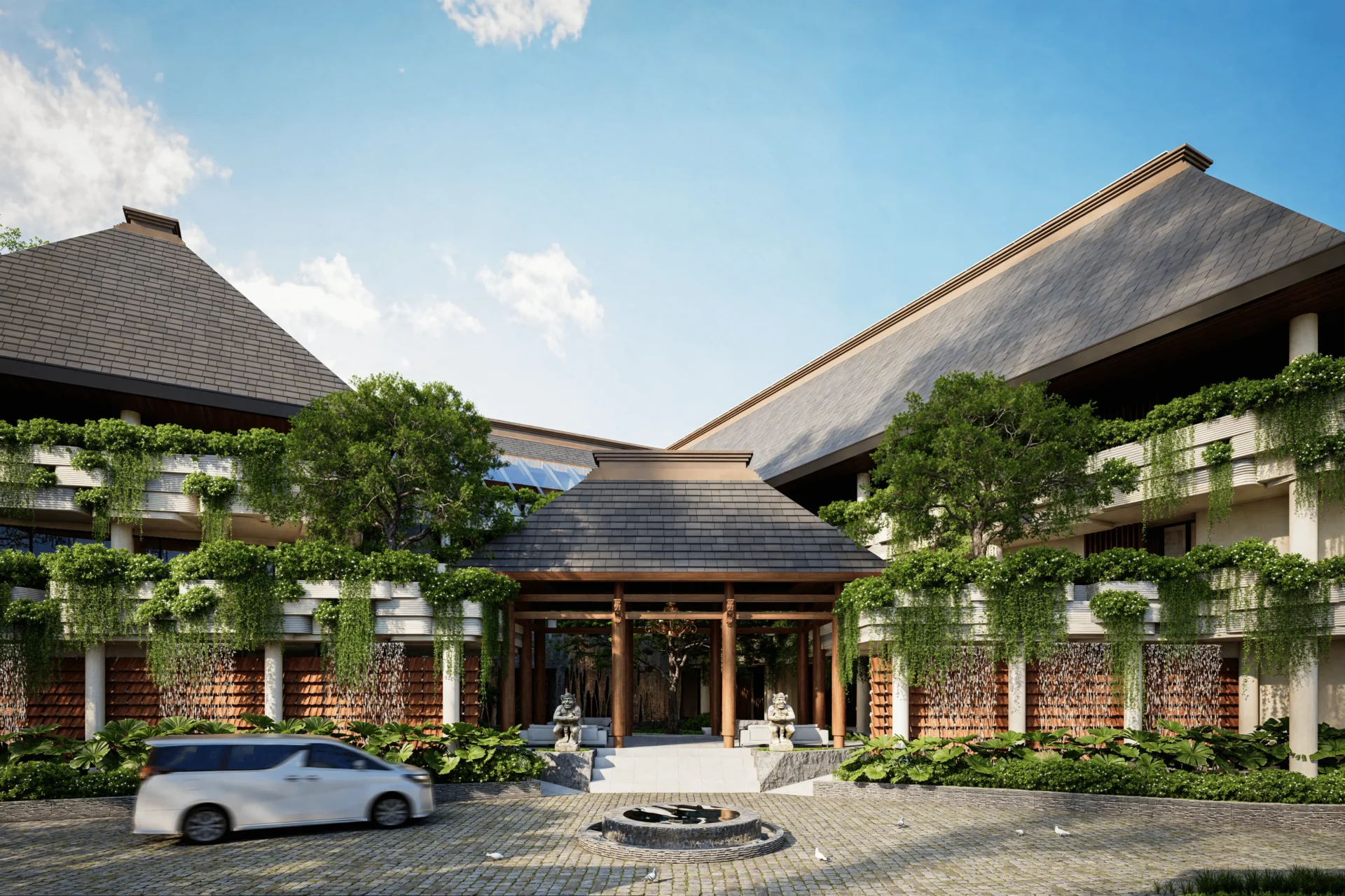 Resort entrance with fountain and lush greenery