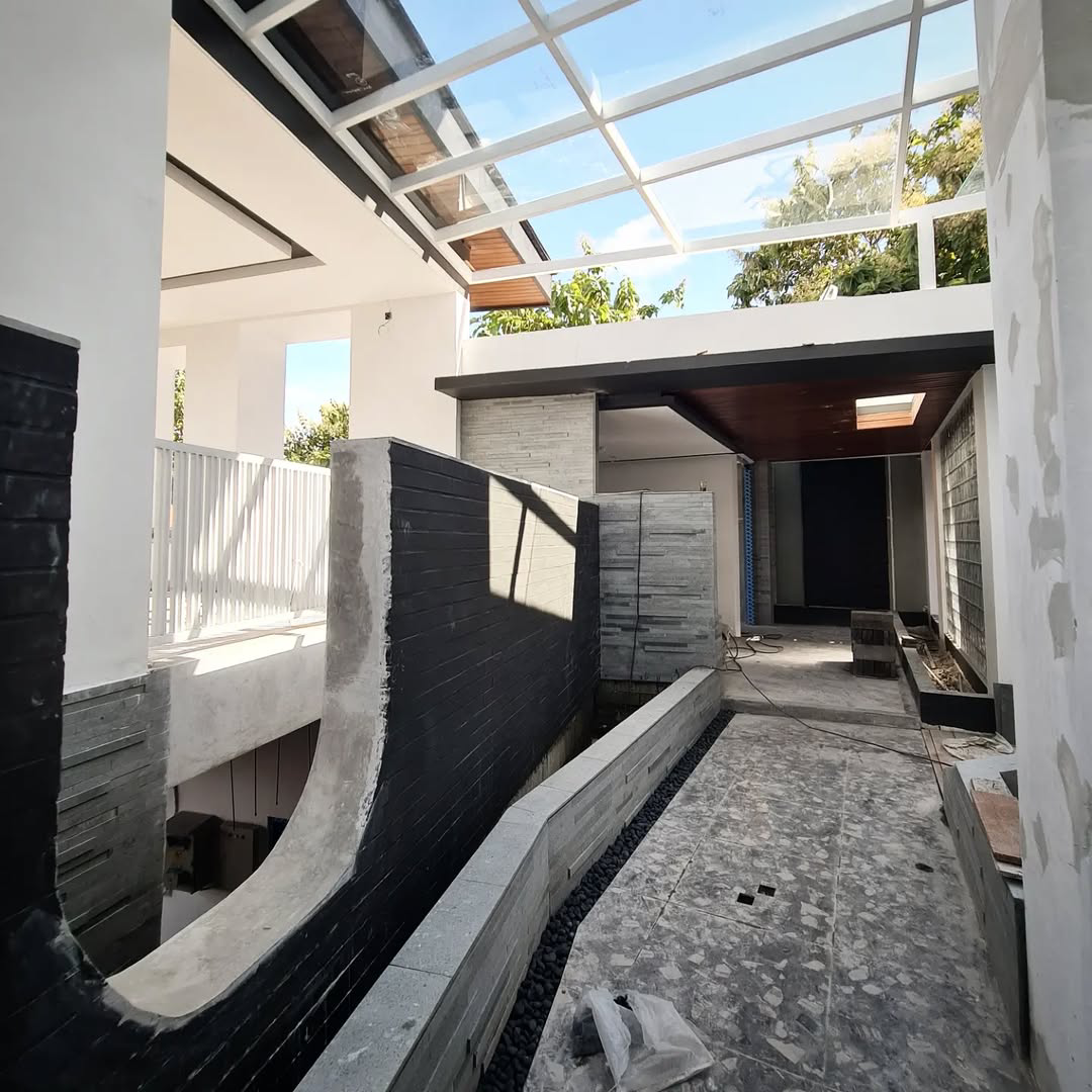 Modern indoor courtyard under construction with skylight