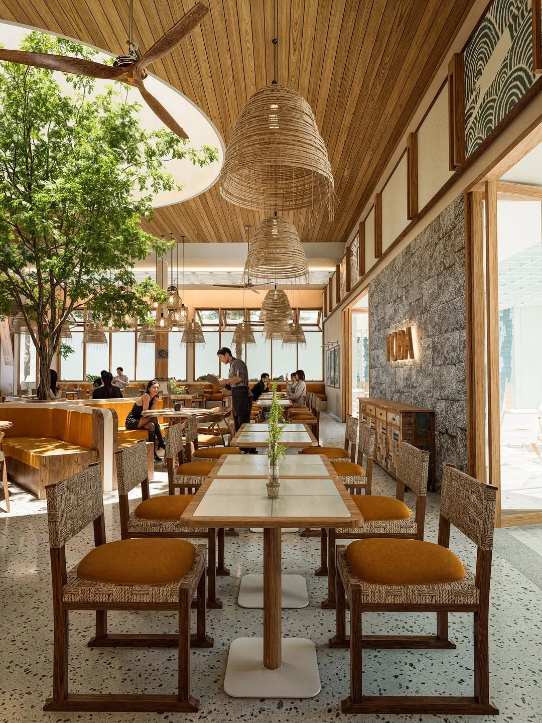 Sunlit wooden dining space with woven pendant lights