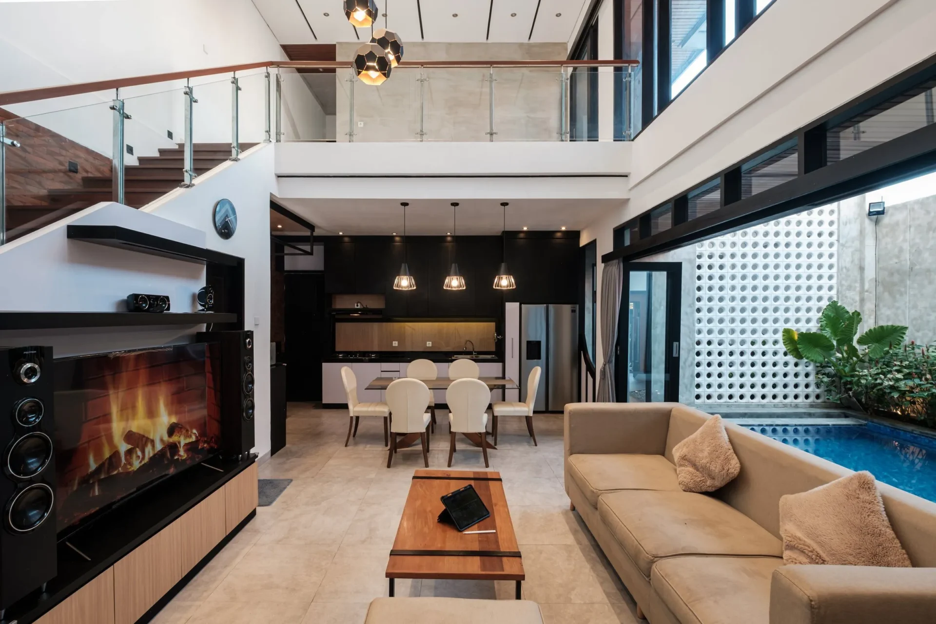 Modern open-plan living room with adjacent pool