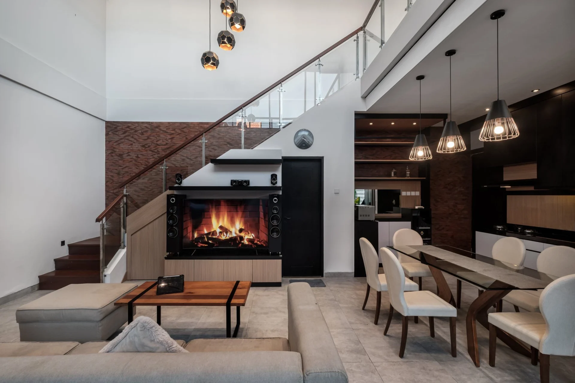 Modern open-plan living and dining area with fireplace