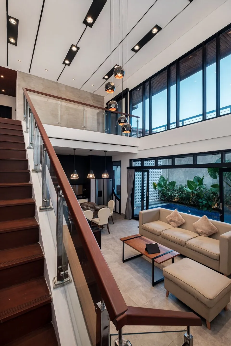 Modern double-height living room with staircase